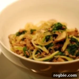 A vibrant bowl of Stir-Fried Kelp Noodles with Ground Beef, Broccoli Slaw, and Spinach