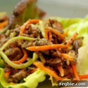 Paleo asian ground beef, mushroom, and broccoli slaw in lettuce cups.