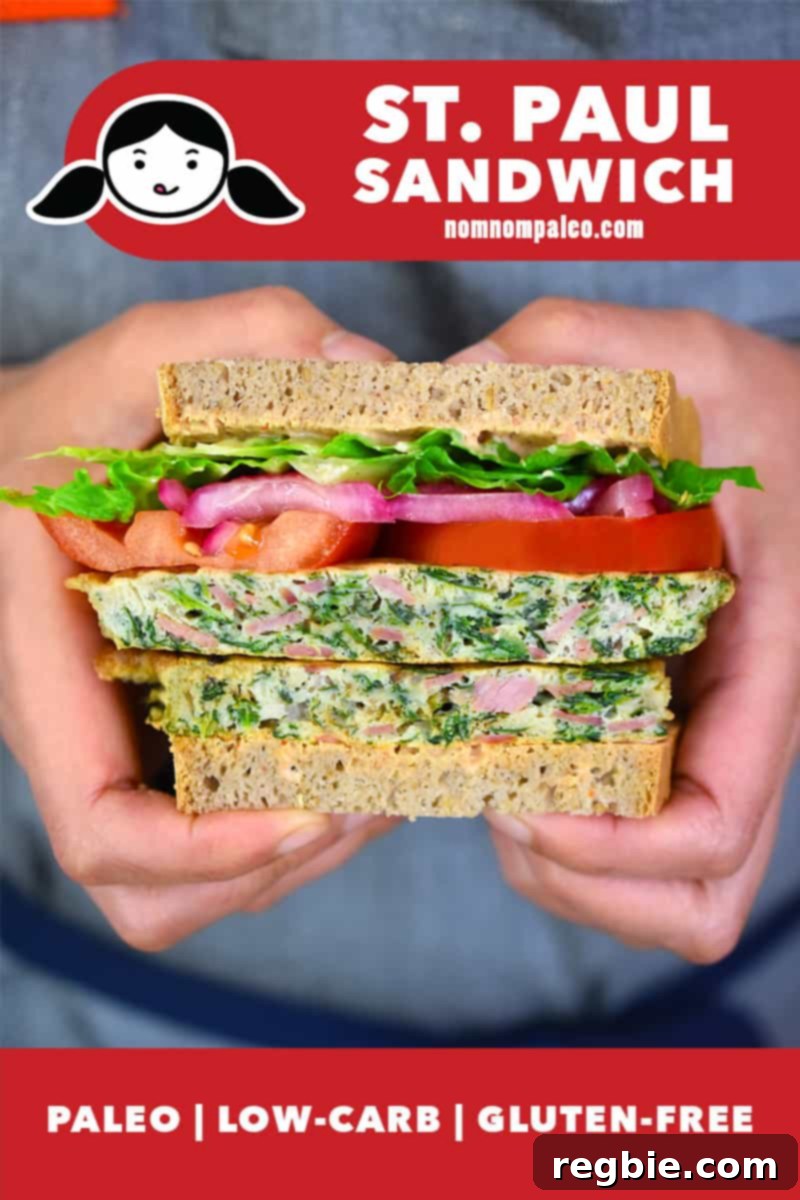Someone holding a paleo and gluten-free St. Paul Sandwich, showcasing its delicious layers.