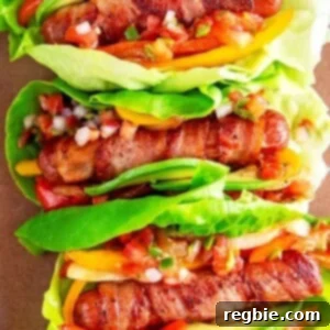 An overhead shot of Whole30, keto, and paleo Sonoran hot dogs wrapped in lettuce and topped with salsa, perfect for a healthy school lunch.