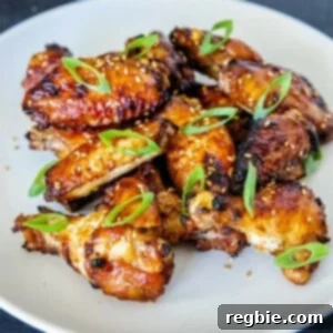 A white plate filled with Whole30, gluten-free, paleo Chinese Chicken Wings, a super easy game day appetizer and great school lunch.