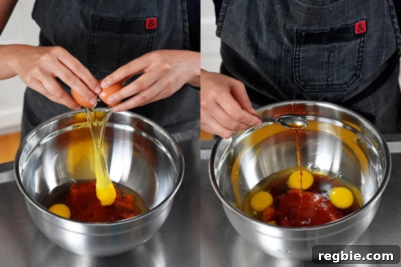 Adding farm-fresh eggs and pure vanilla extract to a bowl containing pumpkin purée and honey, creating the wet mixture for paleo and gluten-free pumpkin chocolate chip muffins.