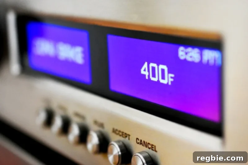 A closeup shot of a wall oven display showing the temperature set to 400 F, indicating it's preheated and ready for baking delicious crispy wings.