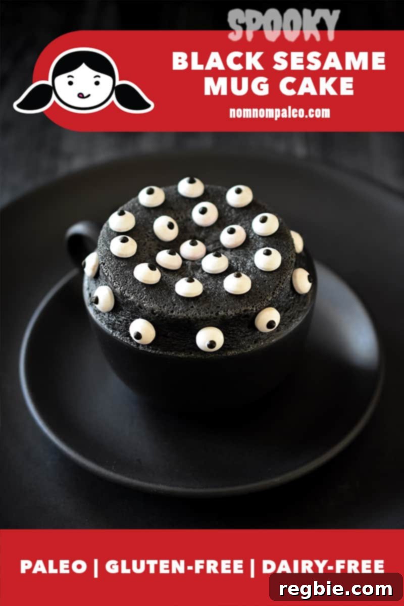 Paleo Black Sesame Mug Cake Indulgence 2 A closeup of a black sesame mug cake in a black mug on two black plates. The dark cake is whimsically covered with candy eyeballs, creating a spooky effect. A red banner indicates it is paleo, gluten-free, and dairy-free.