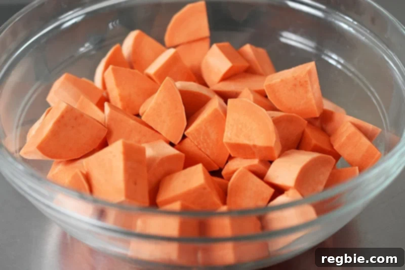 A bowl of sweet potatoes cut into cubes