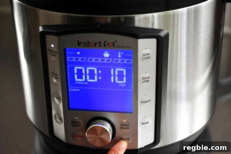 The front display of an Instant Pot Duo Evo Plus the says 10 minutes and high pressure