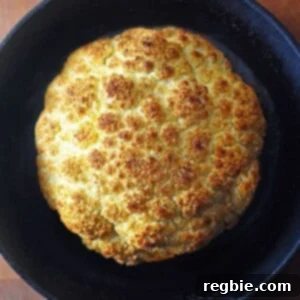 Whole Roasted Cauliflower by Michelle Tam https://nomnompaleo.com. A beautifully roasted whole cauliflower, golden and tender.