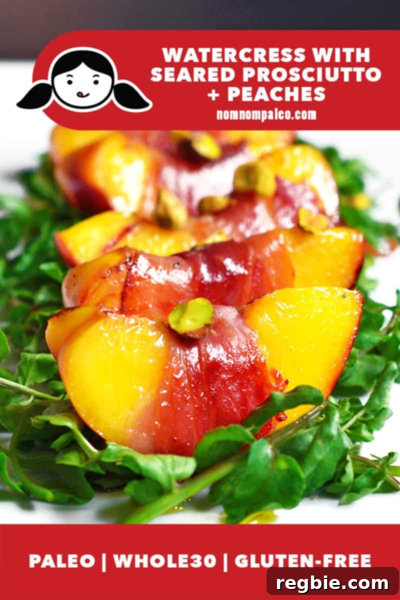 A closeup shot of a white plate topped with watercress salad with prosciutto-wrapped seared peaches and pistachios. There is a red banner at the bottom that lists that this recipe is paleo, Whole30, and gluten-free.
