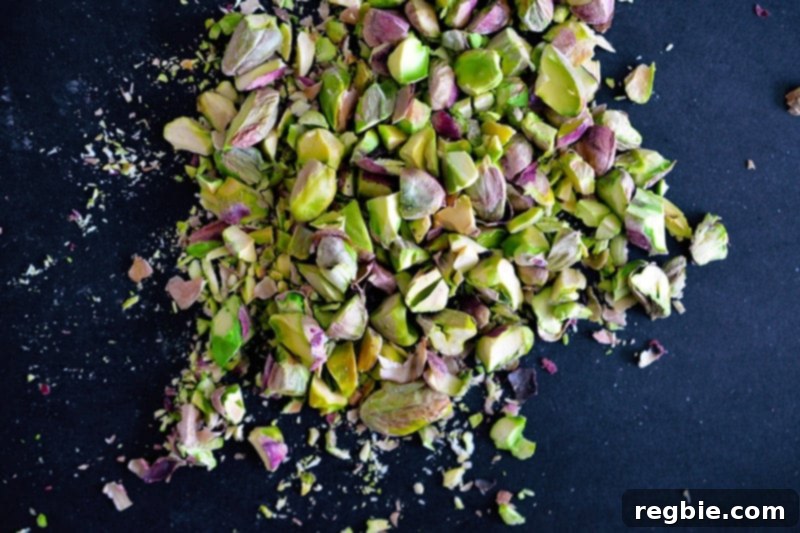 Overhead shot of crushed and chopped pistachios ready for the Watercress with Seared Prosciutto and Peaches.