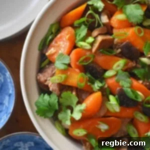 An overhead shot of Instant Pot Vietnamese Pork Stew in a cream colored serving bowl