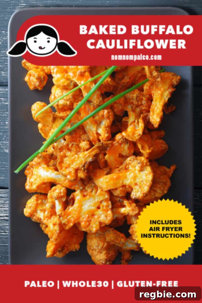 An overhead shot of baked buffalo cauliflower on a gray rectangular plate with fresh chives on top. The vibrant red color of the buffalo sauce contrasts beautifully with the green chives, highlighting its deliciousness. A small banner indicates it's paleo, Whole30, and gluten-free, with air fryer instructions included.