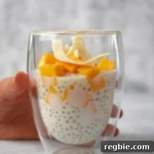 A finished cup of mango sago, topped with toasted coconut flakes.