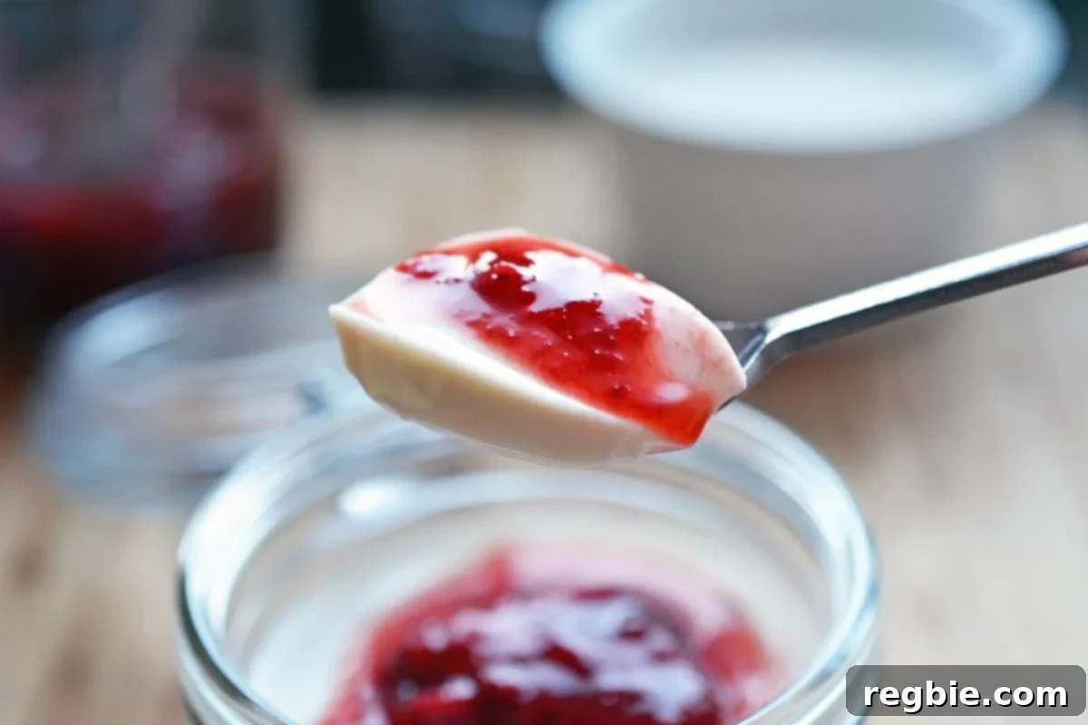 A spoonful of strawberry Panna Cotta.