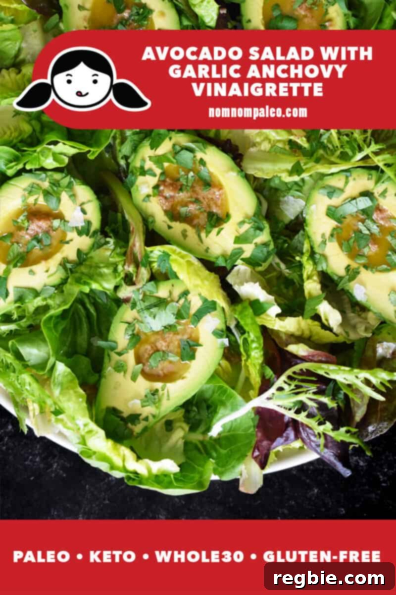 Irresistible Umami Avocado Salad with Garlic Anchovy Vinaigrette 2 A shot of avocado salad with halved avocados filled with a garlic anchovy vinaigrette on mixed greens. There is a red banner at the bottom that reads paleo, keto, Whole30, gluten-free.