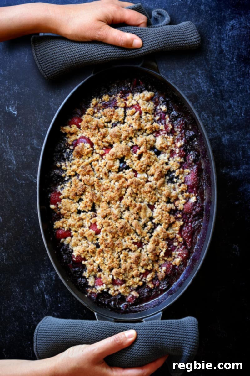 An overhead shot of a paleo and vegan berry crisp fresh out of the oven.