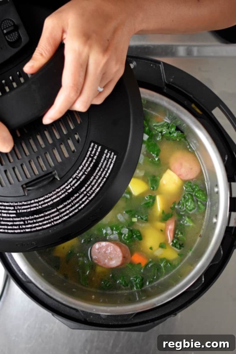 Locking the lid on an Instant Pot for pressure cooking.