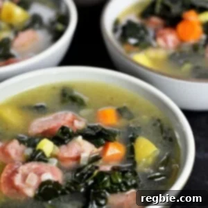 Four bowls filled with comforting sausage and kale soup, ready to eat.