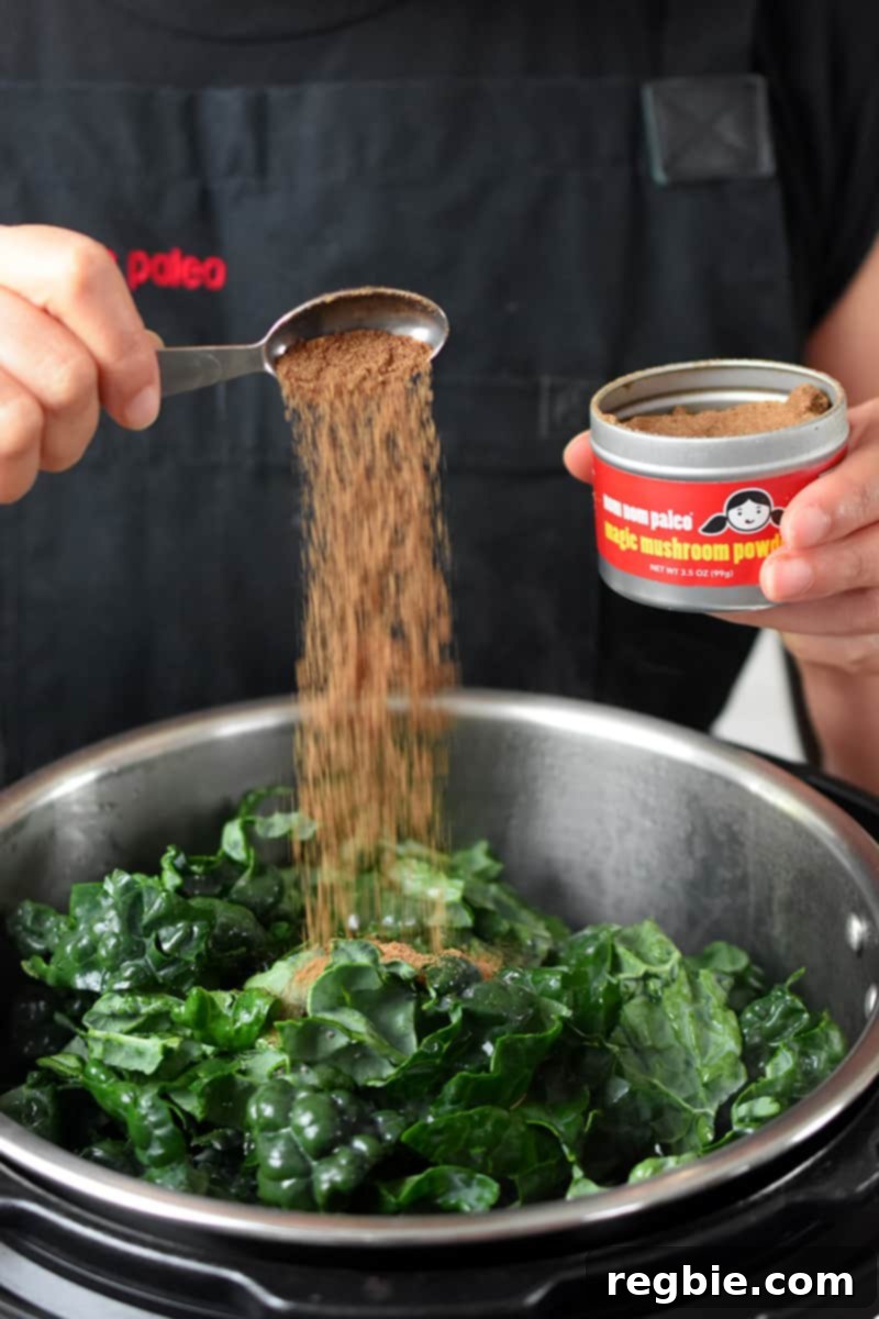 A spoonful of Magic Mushroom Powder being added to the Instant Pot ingredients.