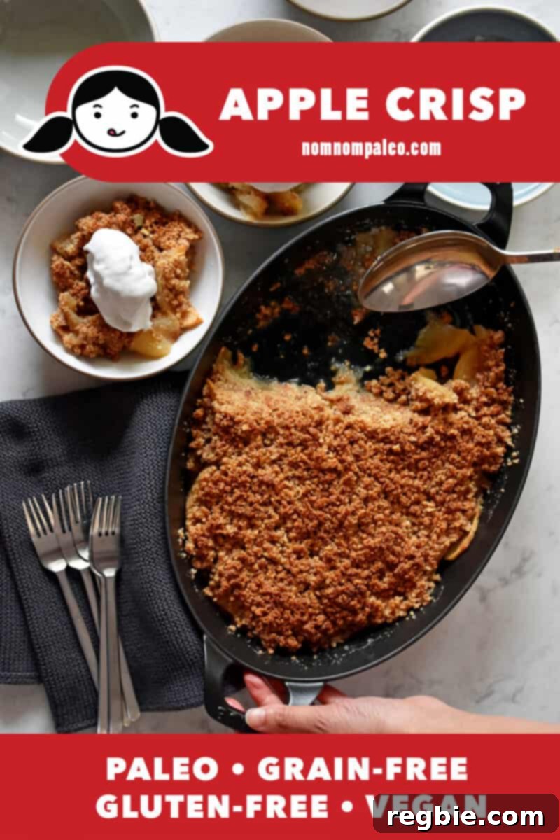 Guilt Free Apple Crisp 2 An overhead shot of paleo and gluten-free apple crisp being scooped out of an oval cast iron baking pan. There is a red banner at the bottom that reads paleo, grain-free, gluten-free, and vegan.