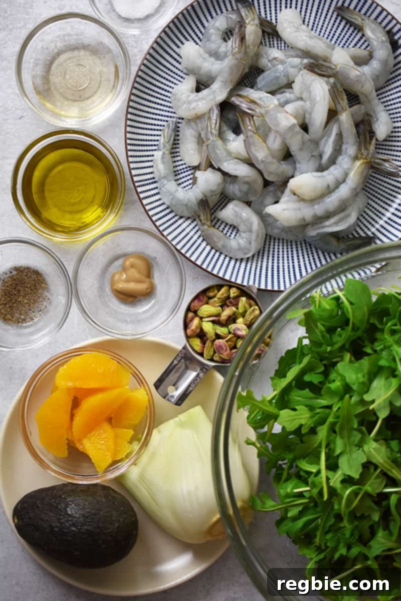 An overhead shot of the raw ingredients for shrimp and avocado salad