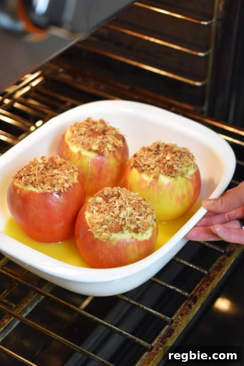 Wholesome Spiced Baked Apples 18 A baking dish with baked apples is put into an open oven.