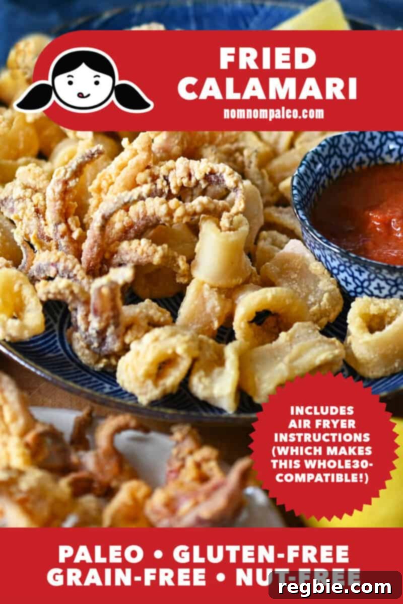 Platters of paleo fried calamari next to small bowls of marinara and sliced lemons, showcasing a delicious, healthy appetizer option.