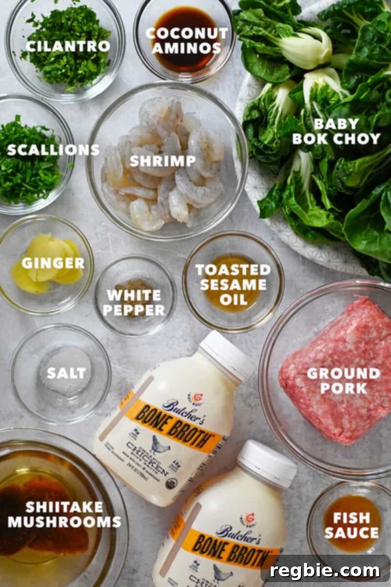 An overhead shot of the raw ingredients neatly arranged to make paleo, Whole30, and keto wonton soup.