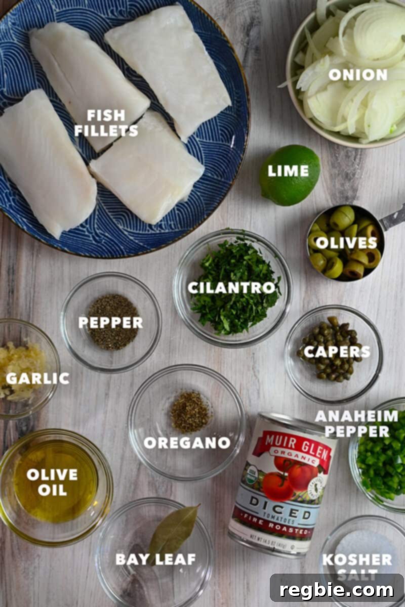 A beautifully arranged selection of fresh, raw ingredients laid out on a kitchen counter, ready to be transformed into a delicious fish in Veracruz sauce.