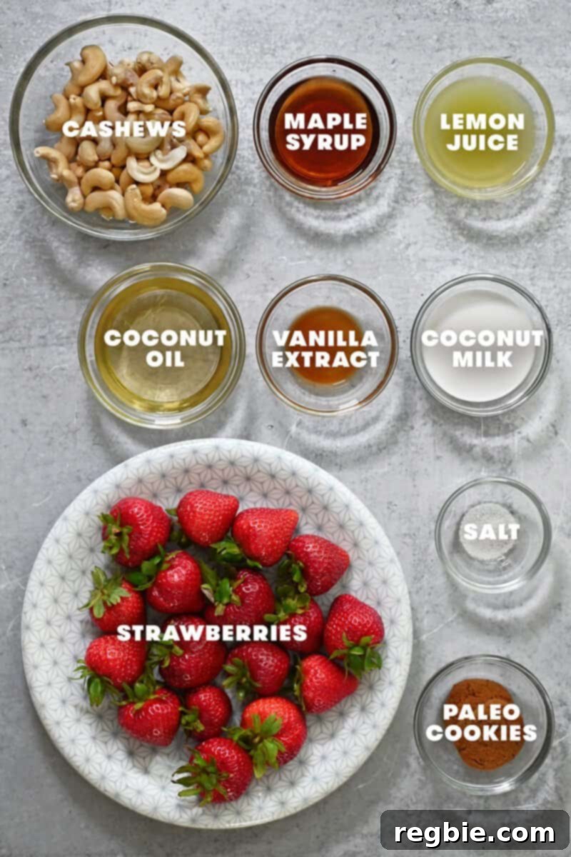 A clearly labelled picture showcasing all the raw ingredients required for making paleo and vegan cheesecake stuffed strawberries, neatly arranged.