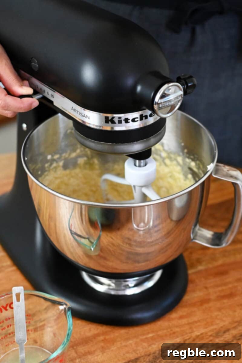Peach Cloud Cake Paleo Gluten Free 12 A Kitchenaid mixer is blending the batter for paleo peach cake.