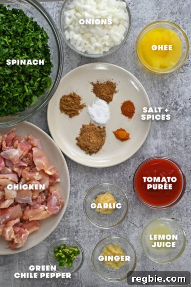Healthy Instant Pot Chicken Saag Whole30 Keto 6 An overhead shot of the raw ingredients to make Indian chicken saag, a chicken and spinach curry.