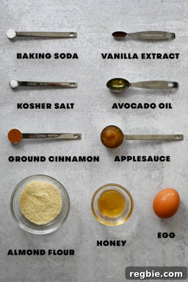 An overhead shot showcasing all the raw ingredients neatly laid out to make a gluten-free cinnamon apple mug cake.