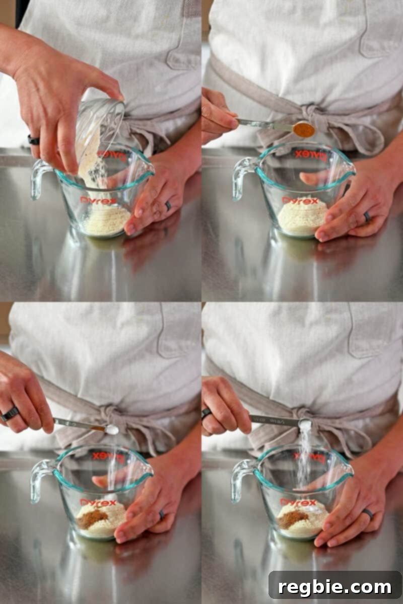 Adding all the dry ingredients for the cinnamon apple mug cake into a Pyrex liquid measuring cup, ready for whisking.