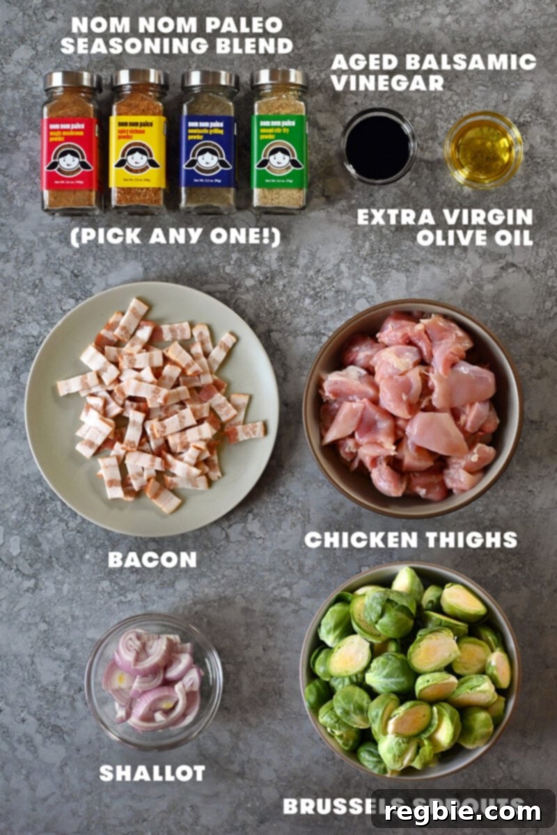 One Pan Chicken and Crispy Brussels Bake 4 The raw ingredients for Sheet Pan Chicken and Brussels sprouts, including fresh chicken, whole Brussels sprouts, bacon slices, and a shallot, neatly arranged before preparation.