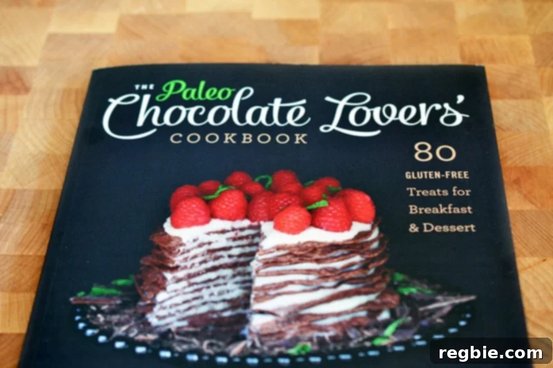 Paleo Vegan Gluten Free Chocolate Graham Cracker Pie 4 Kelly Brozyna's 'The Paleo Chocolate Lovers' Cookbook' sits invitingly on a wooden cutting board, suggesting a world of delicious, healthy chocolate creations within.