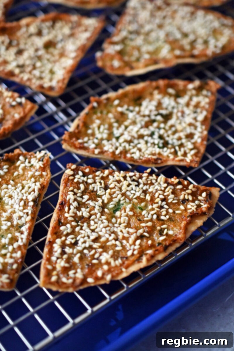 Wholesome Paleo Shrimp Toast 15 A close-up of golden brown paleo and gluten-free shrimp toast cooling on a wire rack, showcasing its texture.