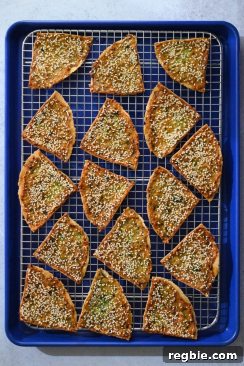 Wholesome Paleo Shrimp Toast 3 An overhead shot of golden brown paleo shrimp toast cooling on a wire rack, demonstrating its crisp texture.