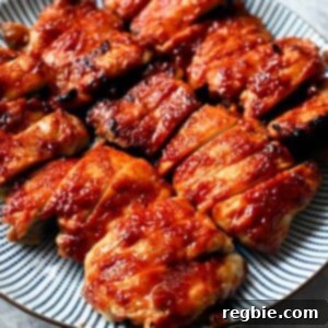 A plate of Char Siu chicken that is sliced up and ready to serve.