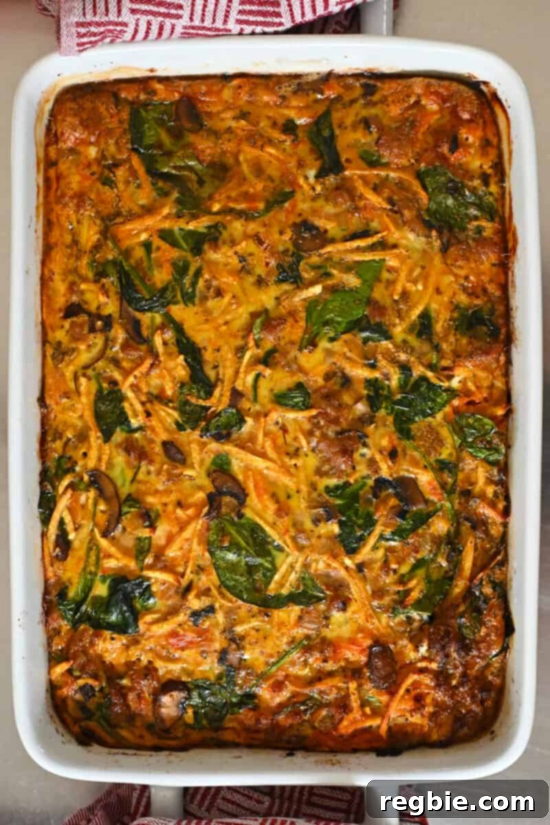 An inviting overhead shot of the freshly baked Italian sausage breakfast casserole, glistening with warmth and ready to be served directly from the oven.