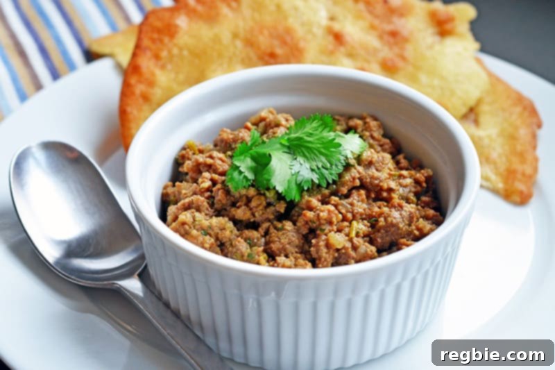Aromatic Keema Samosa Platter 3 Paleo spiced keema in a ramekin, ready to be served. A healthy and flavorful alternative to traditional Indian hand pies.