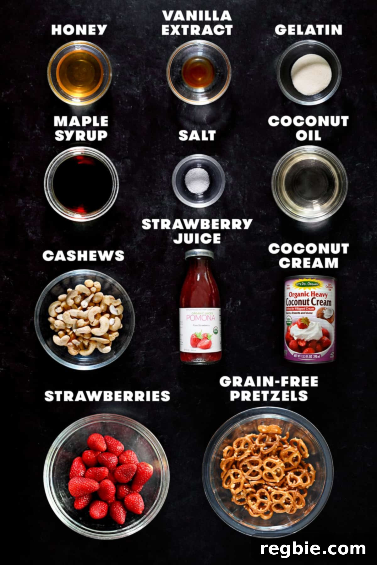 An overhead shot of the raw ingredients laid out to make a paleo-friendly strawberry pretzel salad, including pretzels, cashews, strawberries, and coconut cream.