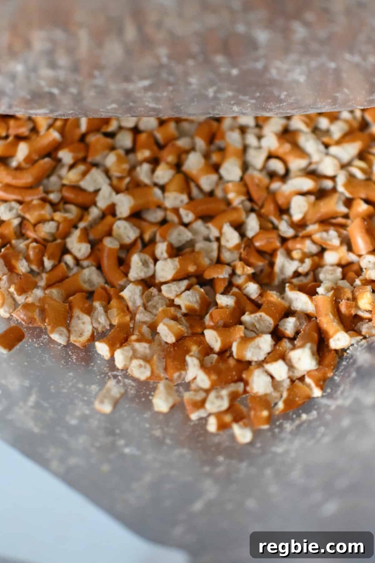 Closeup shot of the perfectly crushed grain-free pretzels, ready to be incorporated into the crust mixture for strawberry pretzel salad.