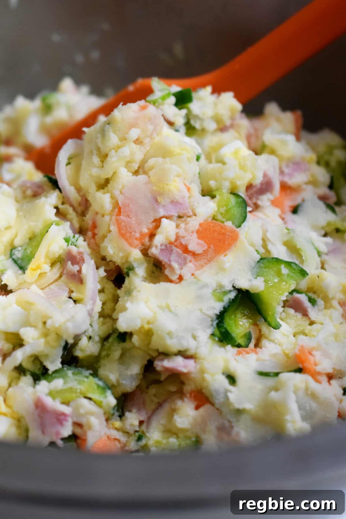 A closeup of a bowl of paleo and Whole30 Japanese potato salad, garnished and ready to serve.