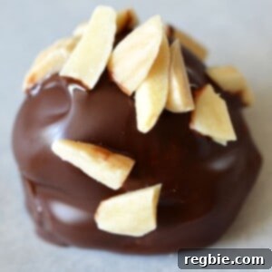 A closeup shot of a Chunky Monkey Ice Cream Bon Bon, a healthy paleo dessert, ready to be enjoyed.
