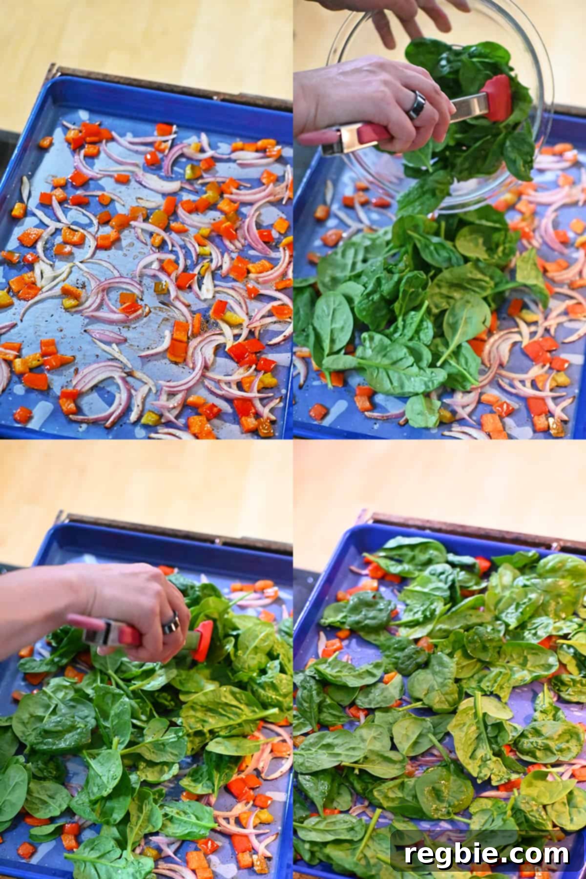 Four shots of someone adding baby spinach to a blue sheet pan with roasted sliced red onions and diced bell peppers and tossing everything with a pair of tongs.