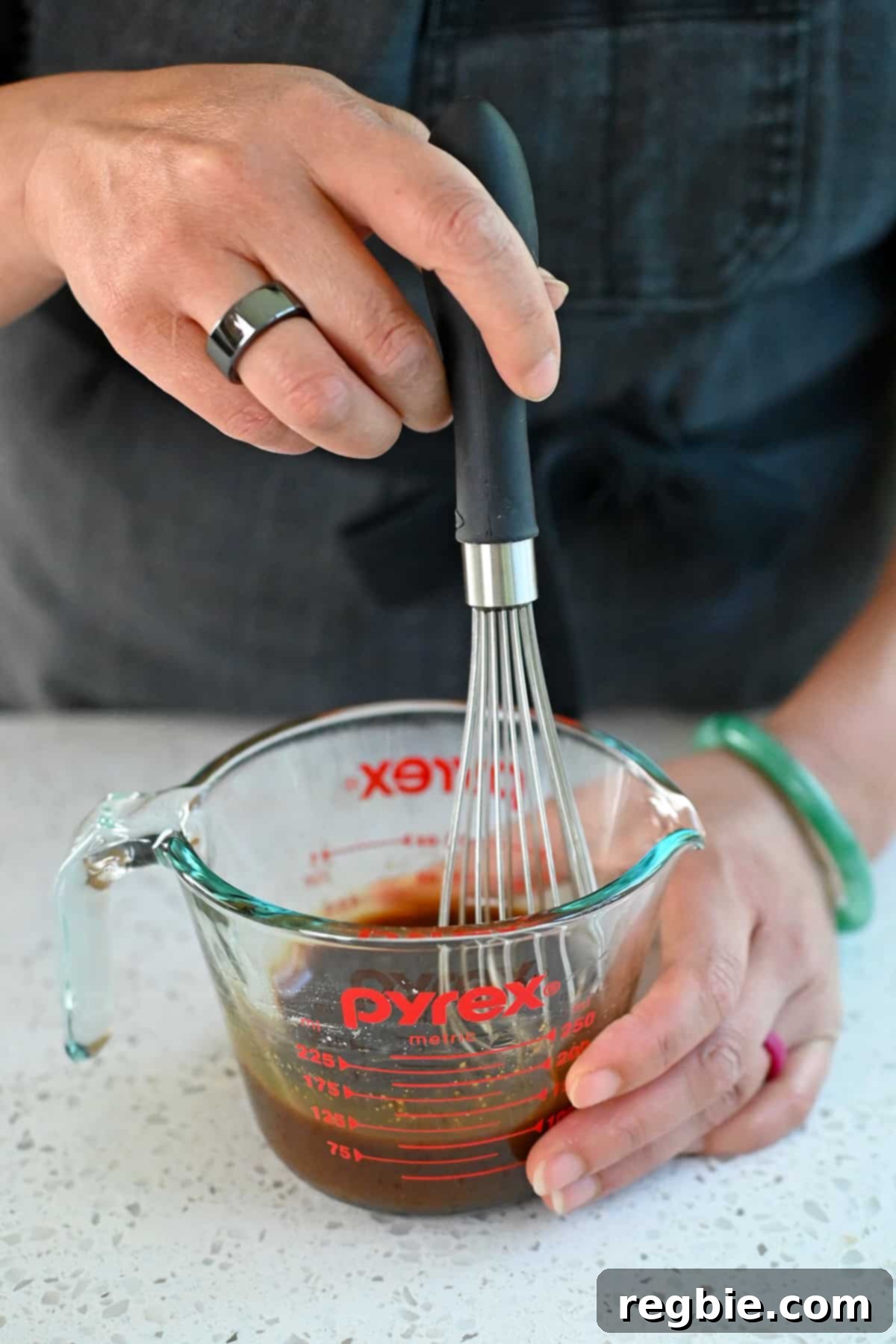 Sheet Pan Cashew Chicken: Paleo & Whole30 Perfection 12 A small whisk is used to smoothly combine paleo All-Purpose Stir-Fry Sauce with a precise amount of arrowroot powder in a liquid measuring cup.