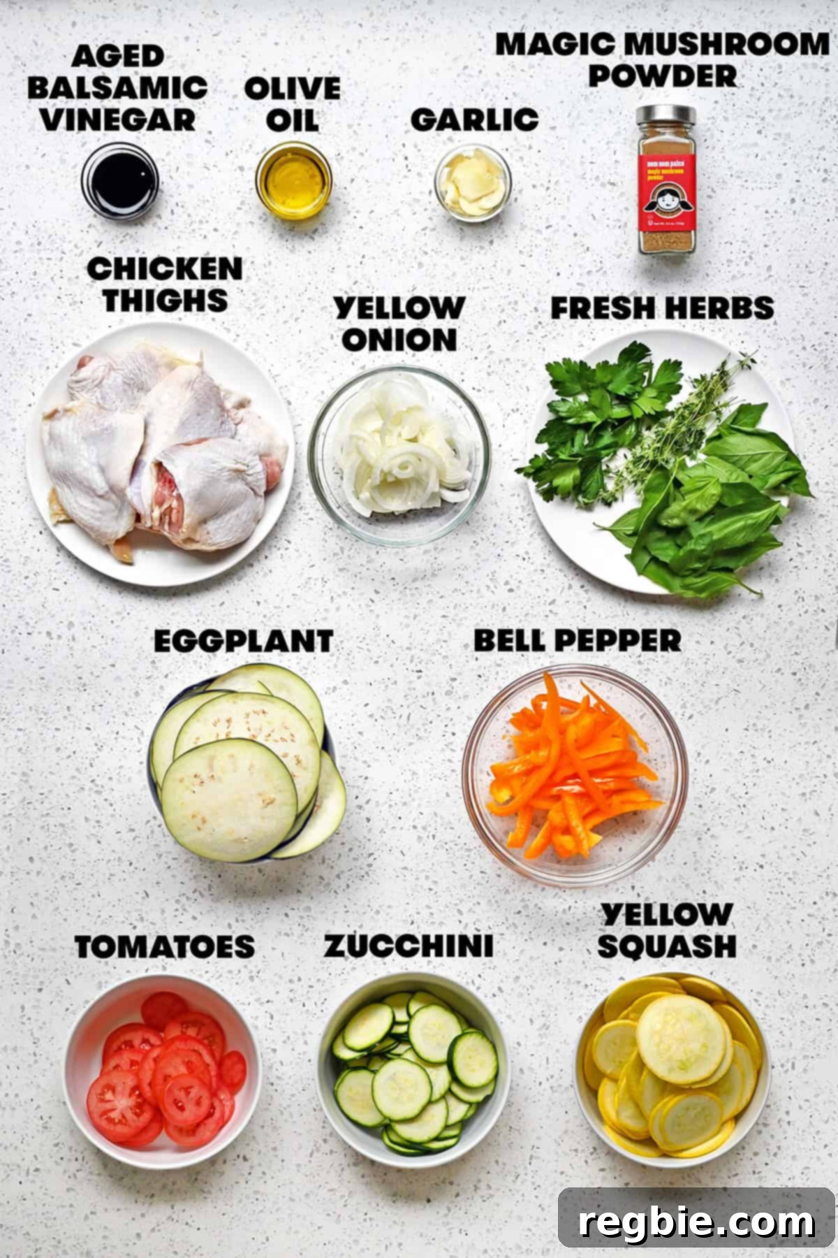 The raw ingredients that are prepped and measured out to make sheet pan chicken and veggies, inspired by ratatouille.