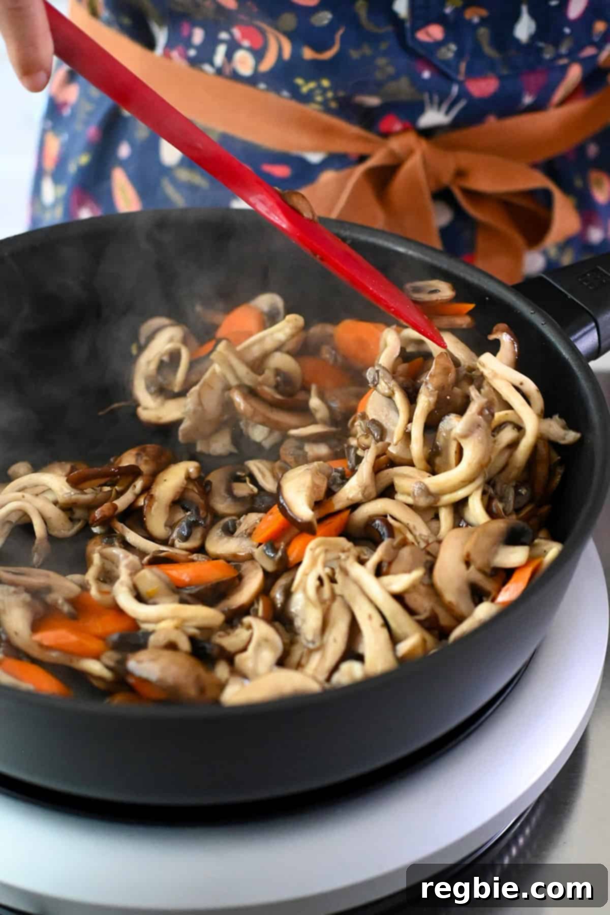 Cantonese Chicken and Mushroom Medley 16 A closeup shot of the sautéed mushrooms and carrots in the frying pan.
