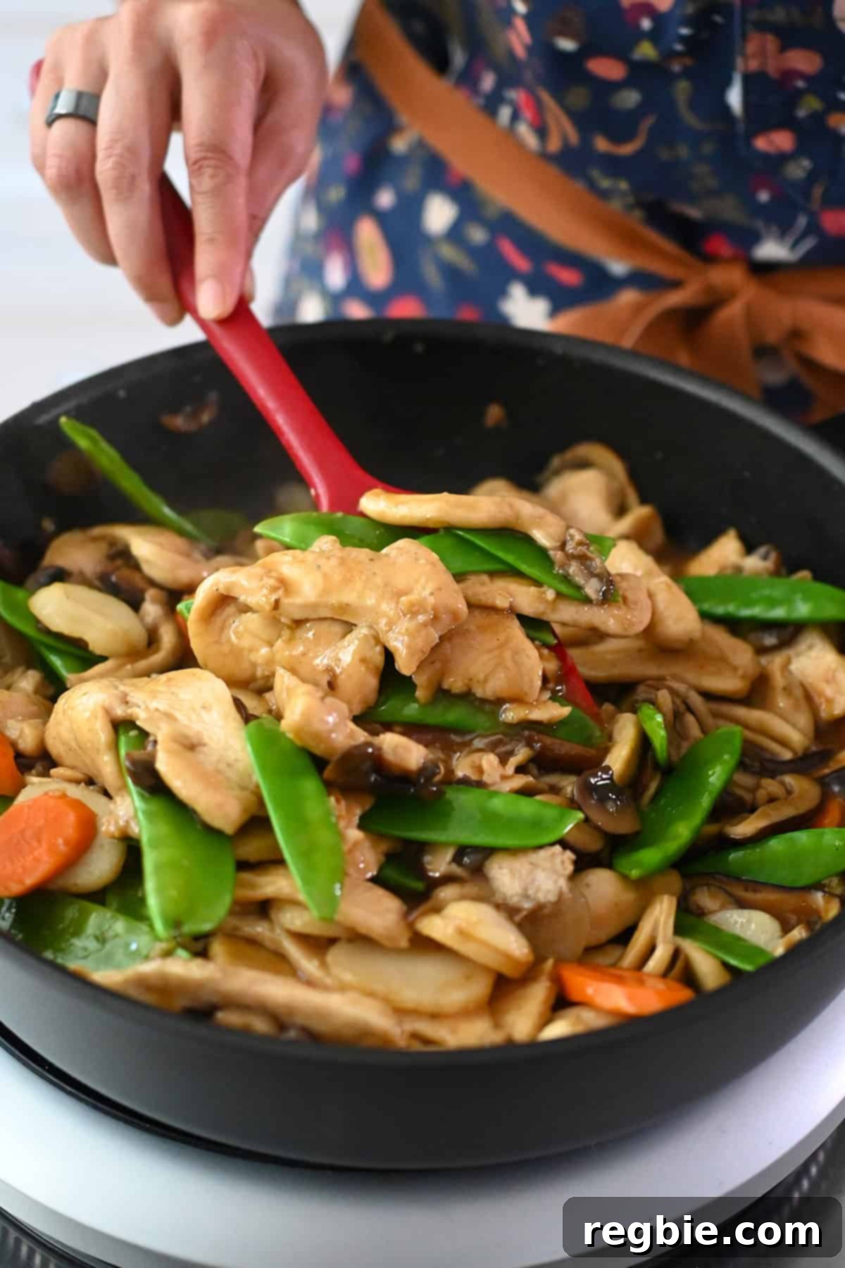Cantonese Chicken and Mushroom Medley 3 A closeup of a frying pan filled with a colorful chicken and mushroom stir fry, moo goo gai pan.