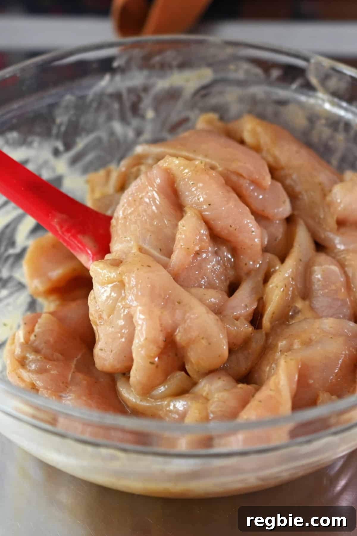 Cantonese Chicken and Mushroom Medley 9 The raw chicken breast slices in the marinade for moo goo gai pan.